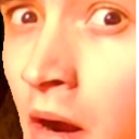 Man with wide eyes and open mouth looking shocked.