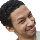Man with a curly-haired hairstyle giving a skeptical, sideways smirk.
