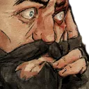 Man with a beard looking nervous while biting his lip in concern.