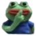 A green frog character holding a finger to its lips in a shushing gesture.