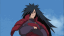 A long-haired anime man with a smug expression and folded arms against a blue sky background.