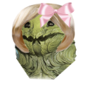 A green leafy monster wearing a large pink bow on its head.