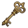 A golden vintage key with an ornate handle set against a black background.