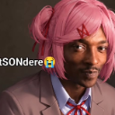 A man wearing a pink anime wig with hair clips looking directly at the camera.
