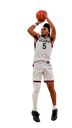 Basketball player jumping high to dunk a basketball.
