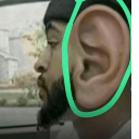 A person's ear is digitally enlarged and circled in bright green to emphasize hearing.