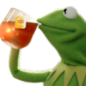 Kermit the frog puppet sipping from a glass of iced tea with a smug expression.
