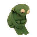 A green felt puppet sitting hunched over with its head down in a pose of deep sadness.