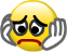 Yellow smiley face with hands pressed against its cheeks and a sad mouth.