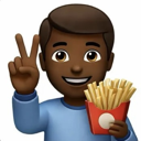 A person with brown skin smiling and holding a red container of french fries while making a peace sign with their other hand.