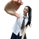 A student in a white shirt and tie reaches their hand toward the camera with a playful expression.