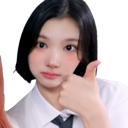 Young woman with short hair giving a thumbs up gesture.