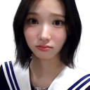A young woman looking directly at the camera with a confused and skeptical facial expression.