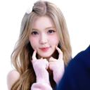 Young woman with blonde hair blushing while holding her hands against her cheeks.