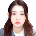 A young woman with brown hair making a pouty facial expression.