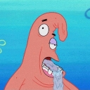 Patrick Star with a vacant expression and drool hanging from his open mouth.