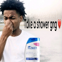 A young man holds his nose with one hand and a bottle of shampoo in the other, with text reading Take a shower gng.