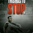 A basketball player sitting on the floor with the text This Has To Stop in bold red letters above them.