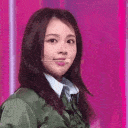 Young woman making funny faces and a finger heart gesture in a four-panel animation.