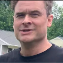 Man with a furrowed brow and a skeptical, questioning facial expression.