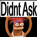 Swedish Chef puppet holding a sign that says Didnt Ask.