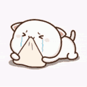 A small white cartoon cat crying while burying its face into a beige pillow.