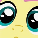 Close up of two large, glossy, blue eyes looking upward with a pleading expression.