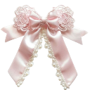 A pink satin bow decorated with intricate lace trim and floral details.