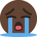 Brown circular face with closed eyes and wide open mouth, shedding two large blue streams of tears.