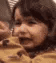 A child with a confused and skeptical facial expression in a grainy, low-resolution photo.