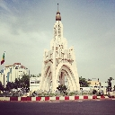 Independence Monument in Bamako stands tall against a cloudy sky.