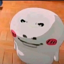 A white blob character with a smug smirk and pink blushing cheeks looking upward.