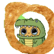 A small green dinosaur character in a onesie vibrating inside a fried onion ring.