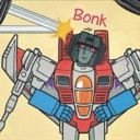 Starscream from Transformers looking dazed after being hit on the head with the word Bonk appearing above him.