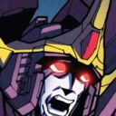 A mechanical robot face with glowing red eyes and an open, screaming mouth.