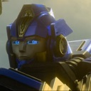 A blue robotic character with glowing eyes stares forward with a skeptical and confused expression.