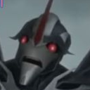 A robotic armored head with glowing red eyes and a wide-open mouth expressing intense terror.