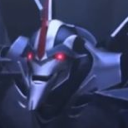 Starscream from Transformers with glowing red eyes and a wide, sinister grin.