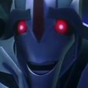 A robotic character with glowing red eyes and a wide, mischievous grin.