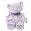 A soft purple teddy bear with a matching ribbon around its neck.