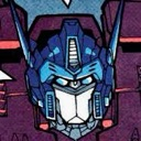 A robotic character head with blue armor and a white faceplate stares directly forward with a serious expression.