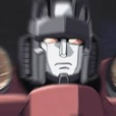 A gray robotic face with a blank, neutral expression and glowing eyes.