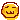 A yellow pixelated cat face with a smug, mischievous expression and a w-shaped mouth.
