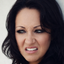 Woman making a disgusted face with her nose wrinkled and mouth slightly open.