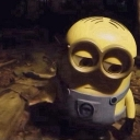 Minion with goggles looking down with a skeptical and unimpressed expression.