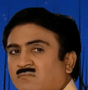 A man with a dark mustache looking sideways with a suspicious and judgmental expression.
