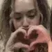 Emoji woman_kiss_heart_hands