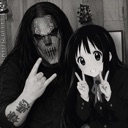 A metalhead with corpse paint making a rock gesture next to a smiling anime girl making a peace sign.