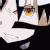 Anime character with glowing yellow eyes and gritted teeth showing intense rage.