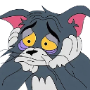 Tom the Cat resting his chin on his hands with a sad, exhausted expression.